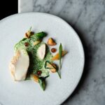 Halibut, pancetta, wild garlic, salsify puree, hedgehog mushrooms, halibut bone sauce (Credit: Jenny Jones Photography)